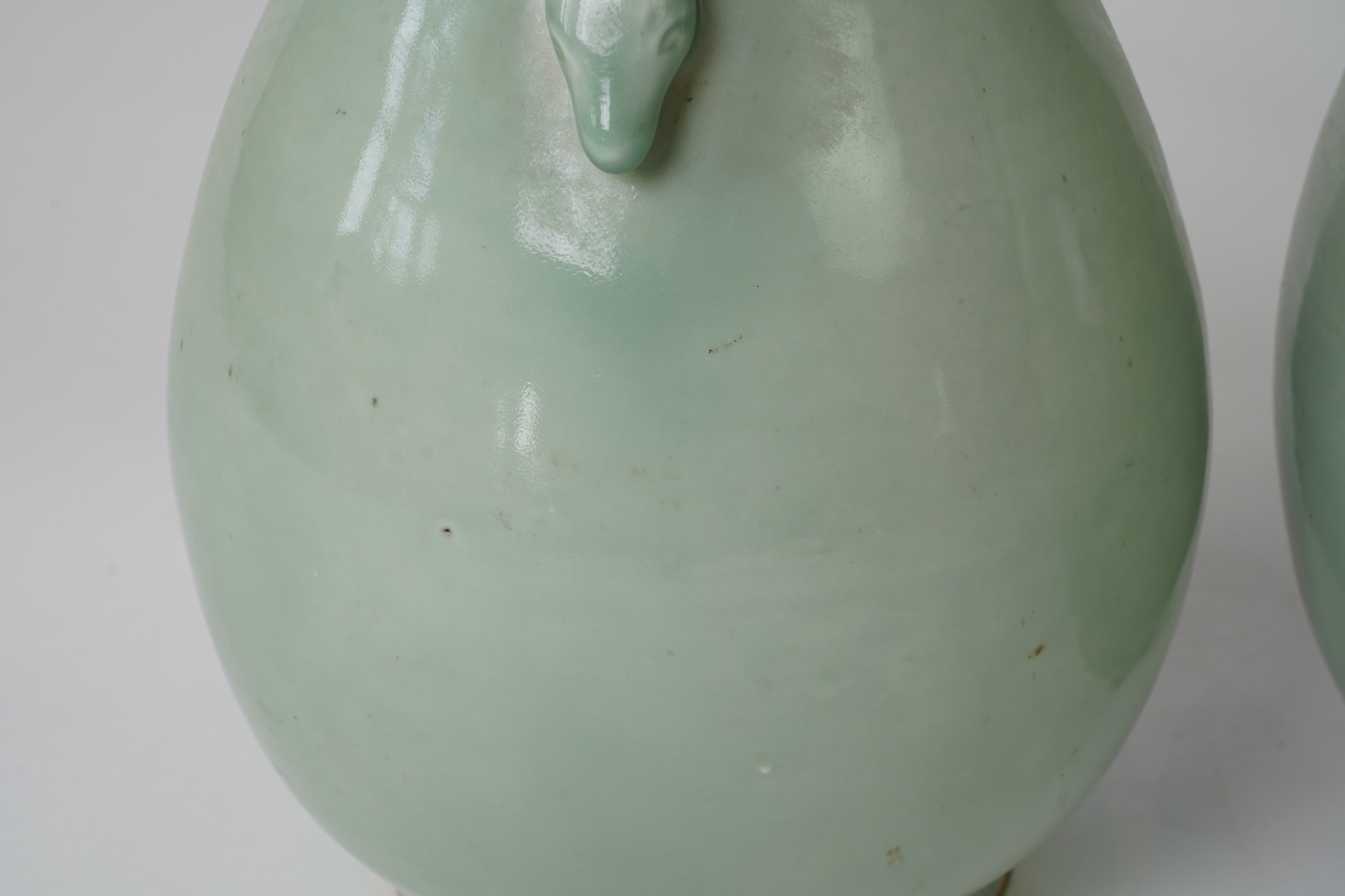 A pair of large Chinese celadon glazed ‘ hu’ vases, Yongzheng seal mark, 19th century